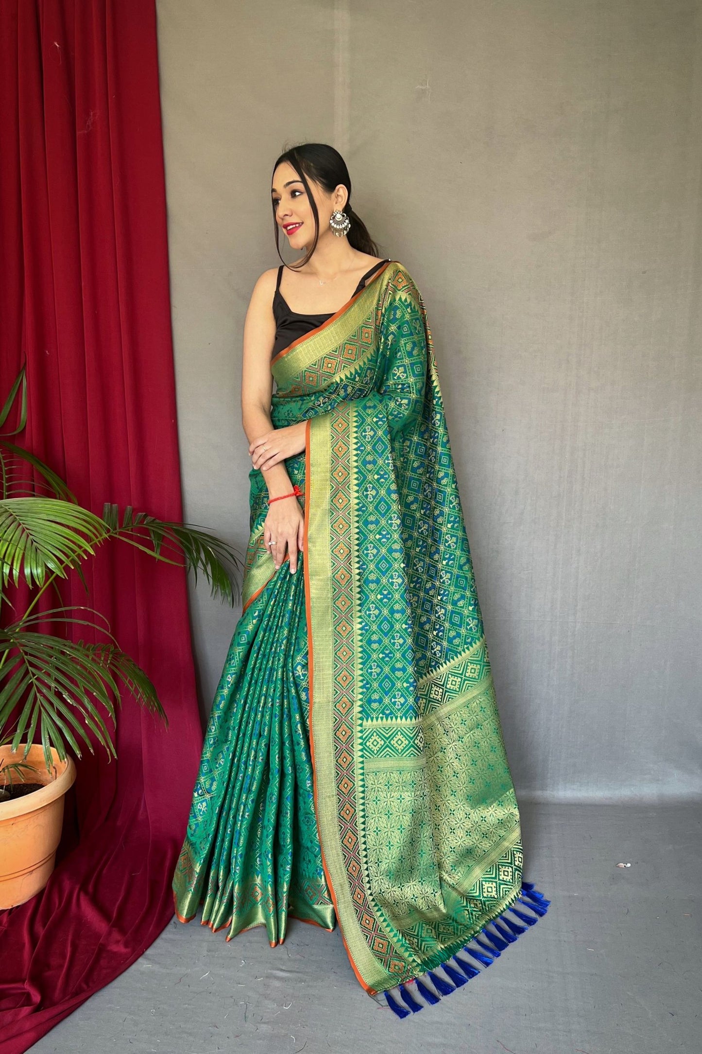 Aqua Green Meenakari Zari Weaving Patola Silk Saree